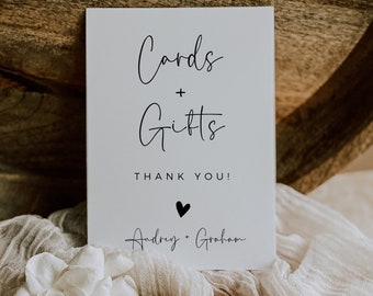 May include: White card with black text that reads "Cards + Gifts Thank You!" with a small black heart and the names "Audrey + Graham" written in cursive.