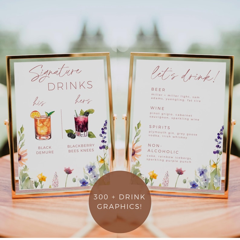May include: Two gold framed signs with floral borders and watercolor illustrations of cocktails. The left sign says "Signature Drinks" with the text "his" and "hers" above two cocktails labeled "Black Demure" and "Blackberry Bees Knees". The right sign says "Let's Drink!" with a list of drinks under the headings "Beer", "Wine", "Spirits", and "Non-Alcoholic".