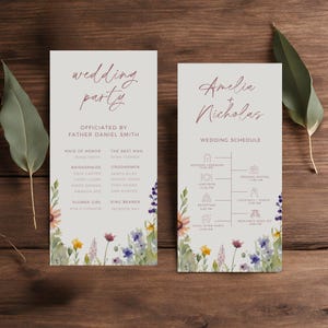 May include: Wedding party schedule card with a floral design. The card lists the wedding ceremony, luncheon, reception, cocktails and toasts, and a send off. The card also includes the names Amelia and Nicholas.