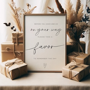 May include: A sign with the text "Before you leave and go on your way, please take a favor to remember the day." The sign is framed in wood and has a heart drawn at the bottom.
