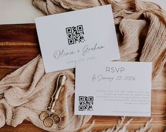 May include: A white wedding invitation with a QR code and the text "Olivia + Graham" and "April 4th, 2026". A second white card with a QR code and the text "RSVP by January 22, 2026" and "Kindly scan the QR code to visit our wedding website for additional information on transportation, hotel accommodations, and wedding reception details. WWW.ANDERSONWEDDING.COM".