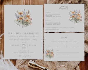 May include: A wedding invitation suite with a watercolor floral design in shades of yellow, blue, and green. The invitation features the names "Madison & Harrison" and the date "September 28, 2028". The details card includes the ceremony and reception locations and times. The RSVP card has two options for guests to choose from: "accept with pleasure" or "decline with regret".