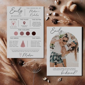 May include: A bridesmaid proposal card with a photo of two women smiling. The card has a pink and brown color scheme and the text "I can't walk down the aisle without your beautiful smile. Will you be my bridesmaid?"