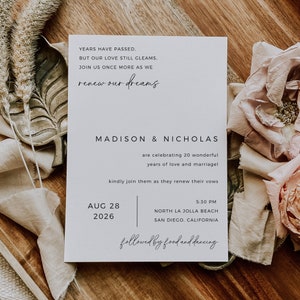 Puede incluir: Una tarjeta de invitaci&oacute;n de boda blanca con el texto "YEARS HAVE PASSED. BUT OUR LOVE STILL GLEAMS. JOIN US ONCE MORE AS WE renew our dreams MADISON & NICHOLAS are celebrating 20 wonderful years of love and marriage kindly join them as they renew their vows AUG 28 2026 5:30 PM NORTH LA JOLLA BEACH SAN DIEGO, CALIFORNIA followed by food and dancing"
