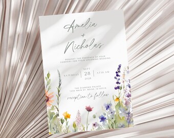 May include: Wedding invitation with a watercolor floral border. The invitation is for Amelia and Nicholas, and the wedding is on September 28th at 10 AM at The Diamond Palace in Boise, Idaho.