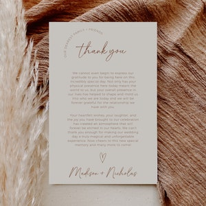 May include: A thank you card with a simple design in beige and brown. The card features the text "thank you" in a handwritten font and the names "Madison + Nicholas" at the bottom. The card expresses gratitude to guests for attending a wedding celebration.