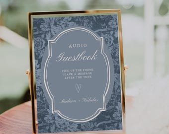 May include: A framed sign with a gold border. The sign has a blue floral background and a central oval with the words "Audio Guestbook." Below, it reads "Pick up the phone, leave a message after the tone." The names "Madison + Nicholas" are at the bottom.
