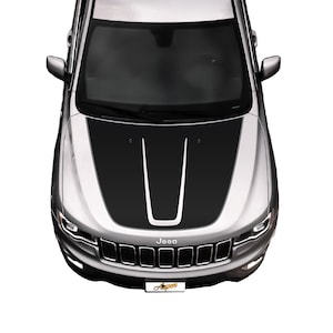 May include: A silver Jeep with a black hood stripe decal. The decal has two black stripes with a white stripe in the center.