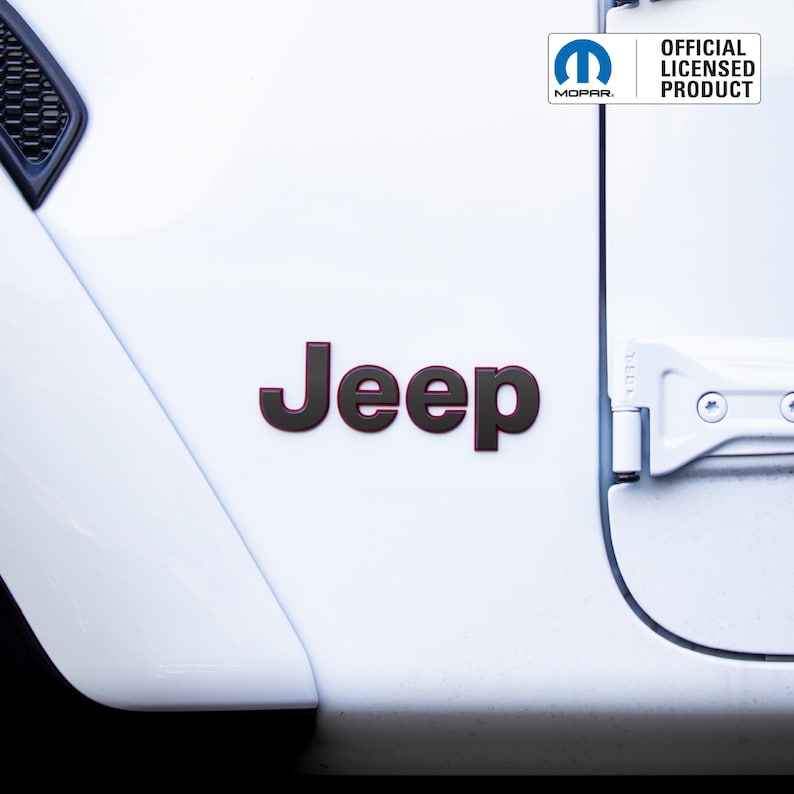 May include: Close-up of a white vehicle door with a black and red "Jeep" emblem. The image also includes the Mopar logo and the text "OFFICIAL LICENSED PRODUCT".