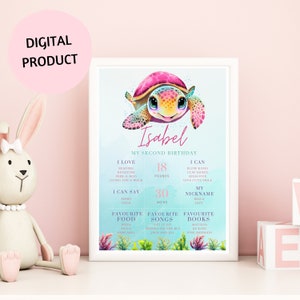 May include: A colorful printable birthday chart for a child turning two years old. The chart features a cartoon sea turtle with pink, blue, and green accents. It includes information about the child's age, weight, height, favorite foods, songs, and books. The chart is titled "Isabel My Second Birthday."