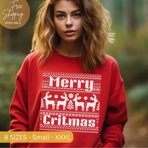 May include: Red Christmas sweater with white pixelated text that reads "Merry Critmas" and a design of reindeer and a Christmas tree.