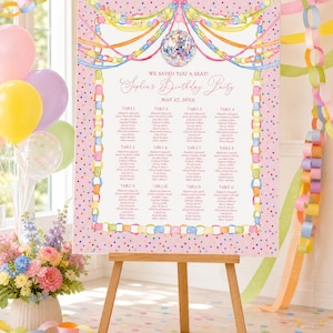 May include: A rectangular birthday party seating chart sign on a wooden easel, featuring a pink background with colorful polka dots, a disco ball illustration, pastel paper chain borders, and text reading We Saved You A Seat Sophia's Birthday Party.
