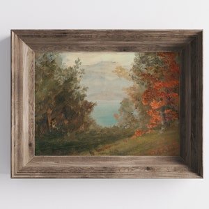May include: A framed painting of a landscape scene with a lake in the distance, surrounded by trees. The trees on the right side of the painting have red leaves.