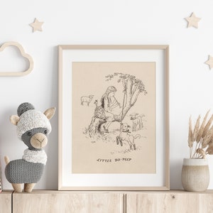 May include: A framed print of a black and white illustration of Little Bo-Peep sitting in a tree with sheep. The print is on a beige background and has the text "Little Bo-Peep" at the bottom.