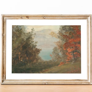 May include: A framed painting depicting a landscape scene with a lake in the distance. The foreground features trees with lush green foliage and a few trees with red leaves. The sky is a light blue with white clouds.