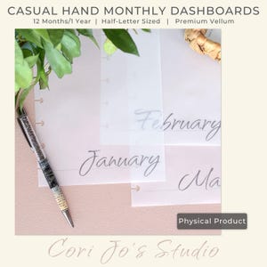 May include: A set of 12 monthly dashboards for a planner. The dashboards are printed on translucent vellum paper and feature handwritten month names in a cursive font. The dashboards are designed for a half-letter sized planner.