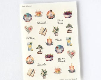 May include: A 4.5 inch by 6.5 inch transparent matte sticker sheet titled REST & RESTORE STICKERS. The sheet features self-care icons including a person in a bathtub, a cup of tea, a person meditating, berries, a journal, a candle, and plants.