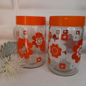 Vintage 1970s orange and white flower kitchen jars