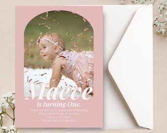 May include: Pink birthday party invitation with a photo of a baby girl in a pink dress crawling on a white rug. The invitation says "Maeve is turning One." and includes details for the party.