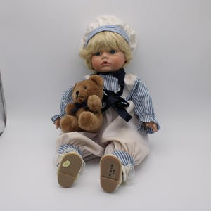 Porcelain Boy Doll with Teddy Bear