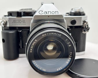Cámara Canon AE-1 Program de 35 mm con objetivo de 28 mm y correa - ¡Impecable!
