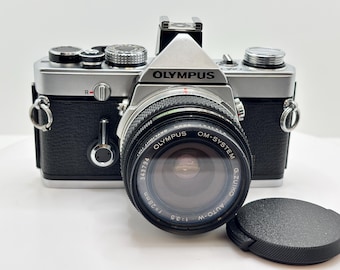 Olympus OM-1n 35 mm-filmcamera met Zuiko 28 mm-lens – onderhouden en klaar!