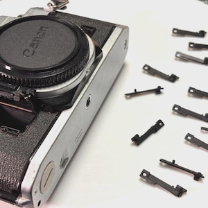 Generic canon ae-1, ae-1 program & a-1 battery door latch - new [tested for fit]