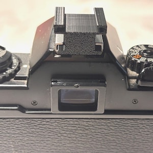 Adaptador de zapata fría para cámara DSLR (se adapta a ambos lados)