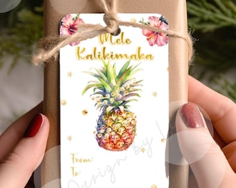 May include: White gift tag with a watercolor pineapple design and gold glitter accents. The tag reads "Mele Kalikimaka!" and has a space for "From" and "To".