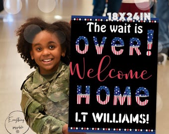 May include: A black welcome home sign with red, white, and blue stars and stripes. The sign reads "18x24in The wait is over! Welcome home LT WILLIAMS!" A young person in camouflage clothing is holding the sign.