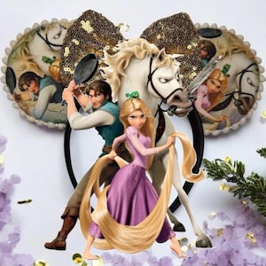 May include: A headband featuring two circular ears decorated with a printed scene of a man and a woman, a large gold sequined bow, and a central graphic of a man holding a frying pan, a woman with long blonde hair, and a white horse.