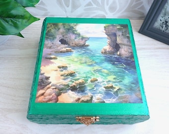 Scene of a lovely beach cove on a wood decor box.