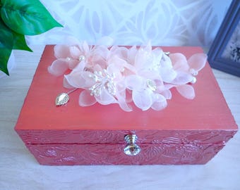 Textured rose bronze colored wood box with spray of delicate organdy flowers on top.