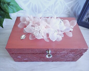Textured rose bronze colored wood box with spray of delicate organdy flowers on top.
