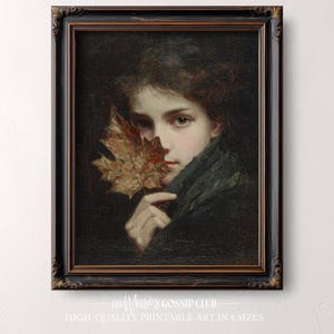 Peut inclure: Un portrait vintage encadré d'une femme tenant une feuille d'automne. L'œuvre présente un fond sombre et un cadre noir orné avec une bordure dorée. Le texte en bas indique "LES MUSES GOSSIP CLUB HIGH-QUALITY PRINTABLE ART IN 8 SIZES."
