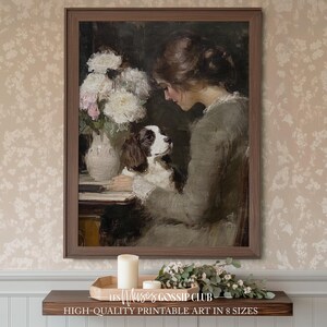 Peut inclure: Peinture vintage encadrée représentant une femme avec un chien et un vase de fleurs. Le chien est blanc et marron. La femme porte une robe grise. La peinture est dans un cadre marron. Le texte en bas indique "HIGH-QUALITY PRINTABLE ART IN 8 SIZES."