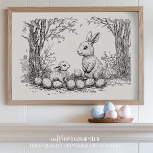 May include: A black and white line drawing of two rabbits in a woodland setting. The larger rabbit is standing on its hind legs and the smaller rabbit is sitting on the ground. Both rabbits are surrounded by a ring of eggs.