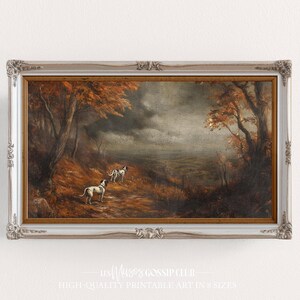 Peut inclure: Impression d'art encadrée de style ancien représentant un paysage avec deux chiens. L'œuvre représente un chemin à travers une forêt avec un feuillage d'automne. Le cadre est orné et de couleur claire. L'impression a une esthétique vintage.