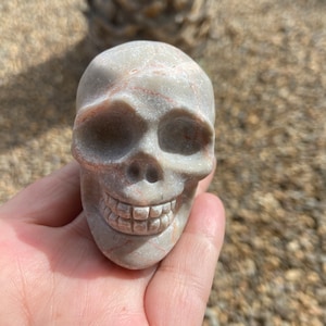 Beautiful red vein network jasper skull craving
