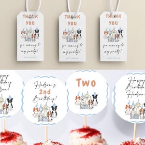 Peut inclure: Un ensemble de d&eacute;corations de f&ecirc;te imprimables repr&eacute;sentant un groupe de chiens portant des chapeaux de f&ecirc;te. Les d&eacute;corations comprennent des d&eacute;corations de cupcakes avec le texte "Hudson's 2nd Birthday!" et "Two", ainsi que des &eacute;tiquettes de remerciement qui disent "Merci d'&ecirc;tre venu &agrave; ma f&ecirc;te ! Avec amour, Hudson".