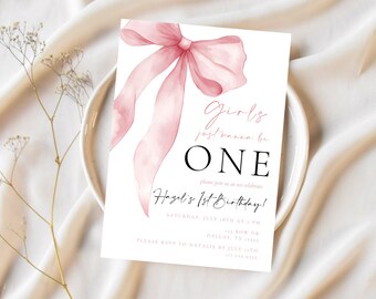 May include: A pink watercolour bow with the text "Girls just wanna be ONE" and "Hazel's 1st Birthday!" on a white background. The invitation includes the date, time, and location of the party.