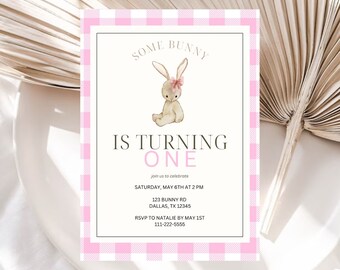 May include: A pink and white gingham patterned invitation with a watercolor illustration of a brown bunny wearing a pink bow. The text reads "Some Bunny is Turning One" with details for a birthday party.
