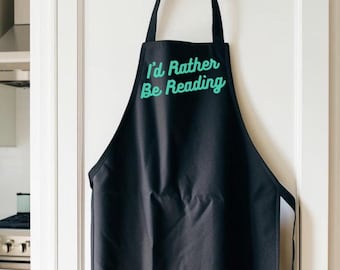 I'd Rather Be Reading Apron | Bookworm Holiday Gift | Book Funny Apron | Literary Lover Bookish Merch | Librarian Teacher Reader Apron Gift