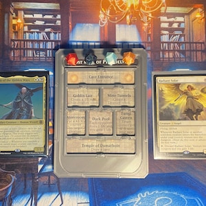 May include: A Magic: The Gathering card game setup featuring three cards and a gray plastic game board. The cards include "Sefin of the Hidden Ways" and "Radiant Solar". The board has slots for dice and game instructions.