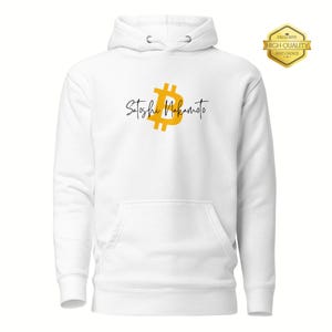 May include: White hoodie with a front pocket and drawstring hood. The design features a gold Bitcoin symbol and the text "Satoshi Nakamoto" in black script. A gold "Exclusive High Quality Best Choice" emblem is in the upper right corner.