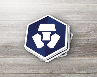 May include: A stack of blue and white stickers with a white hexagon logo featuring a stylized lion's head. The logo is on a dark blue background.