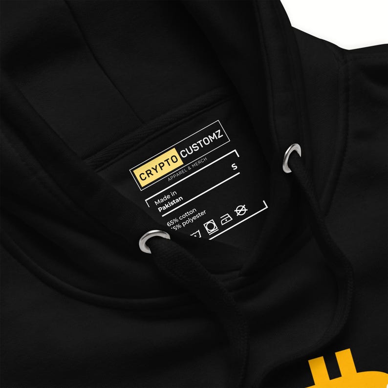 May include: Black hoodie with a drawstring and a tag that reads "CRYPTO CUSTOMZ APPAREL & MERCH". The tag also indicates the hoodie is made in Pakistan and lists the fabric composition as 65% cotton and 35% polyester.