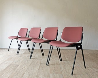 Four stacking chairs by Giancarlo Piretti for Castelli