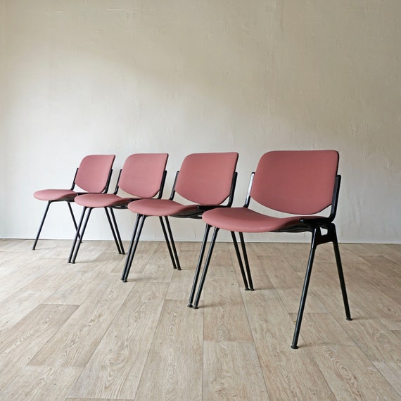 Four stacking chairs by Giancarlo Piretti for Castelli