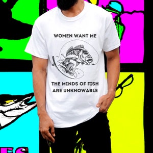 May include: White t-shirt with a black and white graphic of a fish on a hook. The text "Women Want Me" and "The Minds of Fish Are Unknowable" is printed on the shirt.